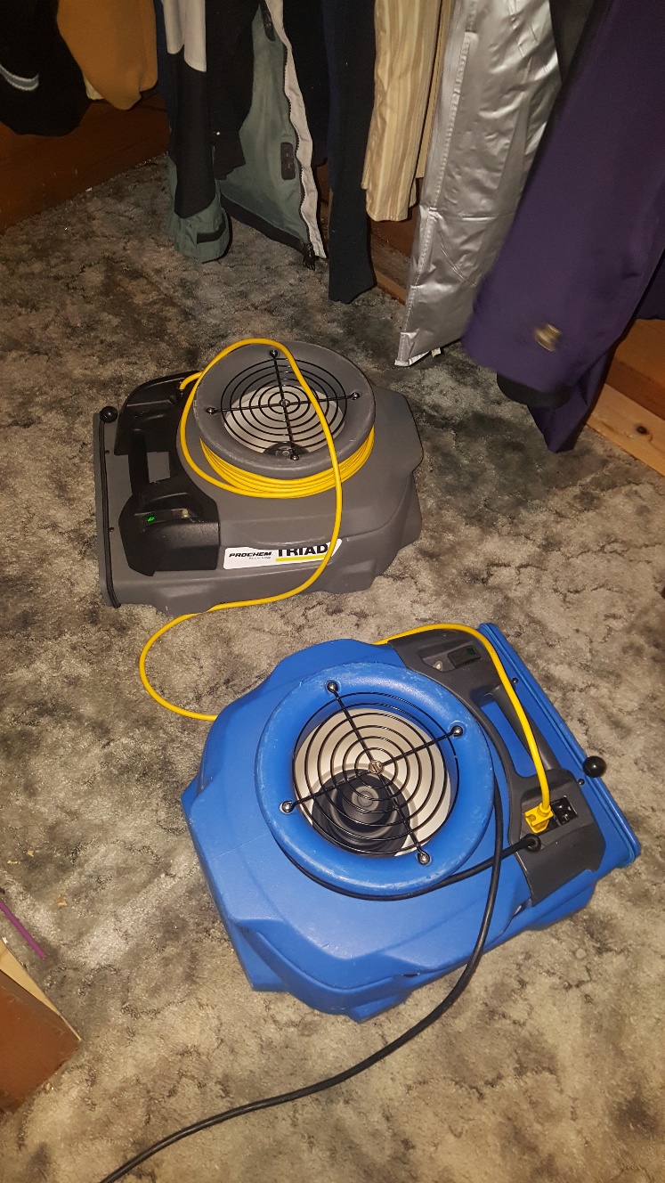 air mover drying out the flooded area in clients basement