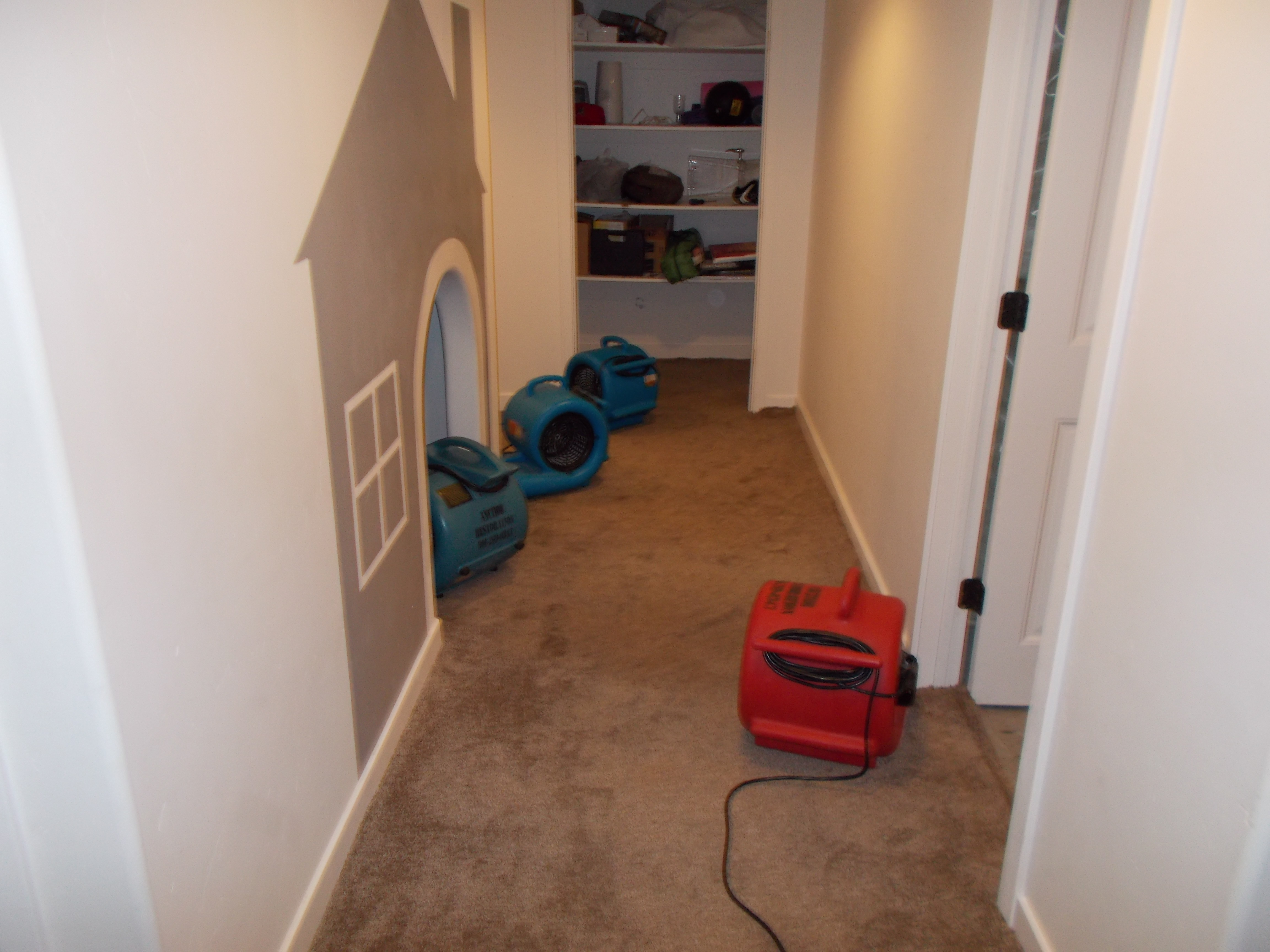 high velocity air movers are set up to dry the area quickly