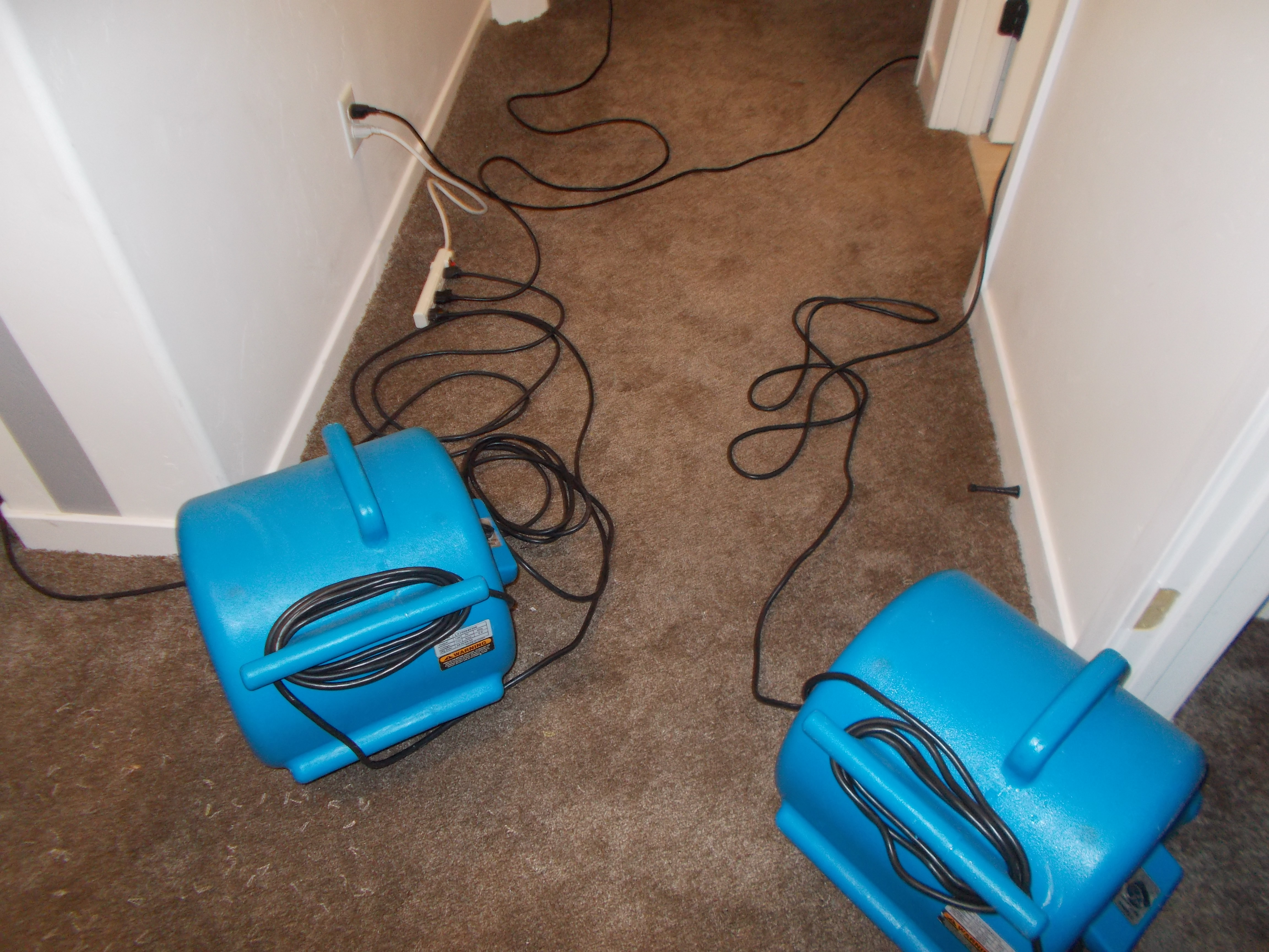 high velocity air movers are set up to dry the area quickly